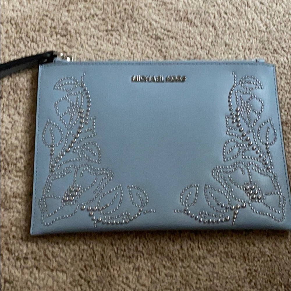 Michael kors wristlet great for going out.